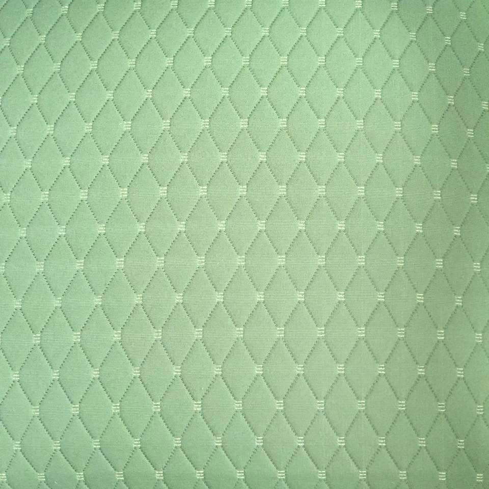 Green upholstered chair in progress for custom upholstery