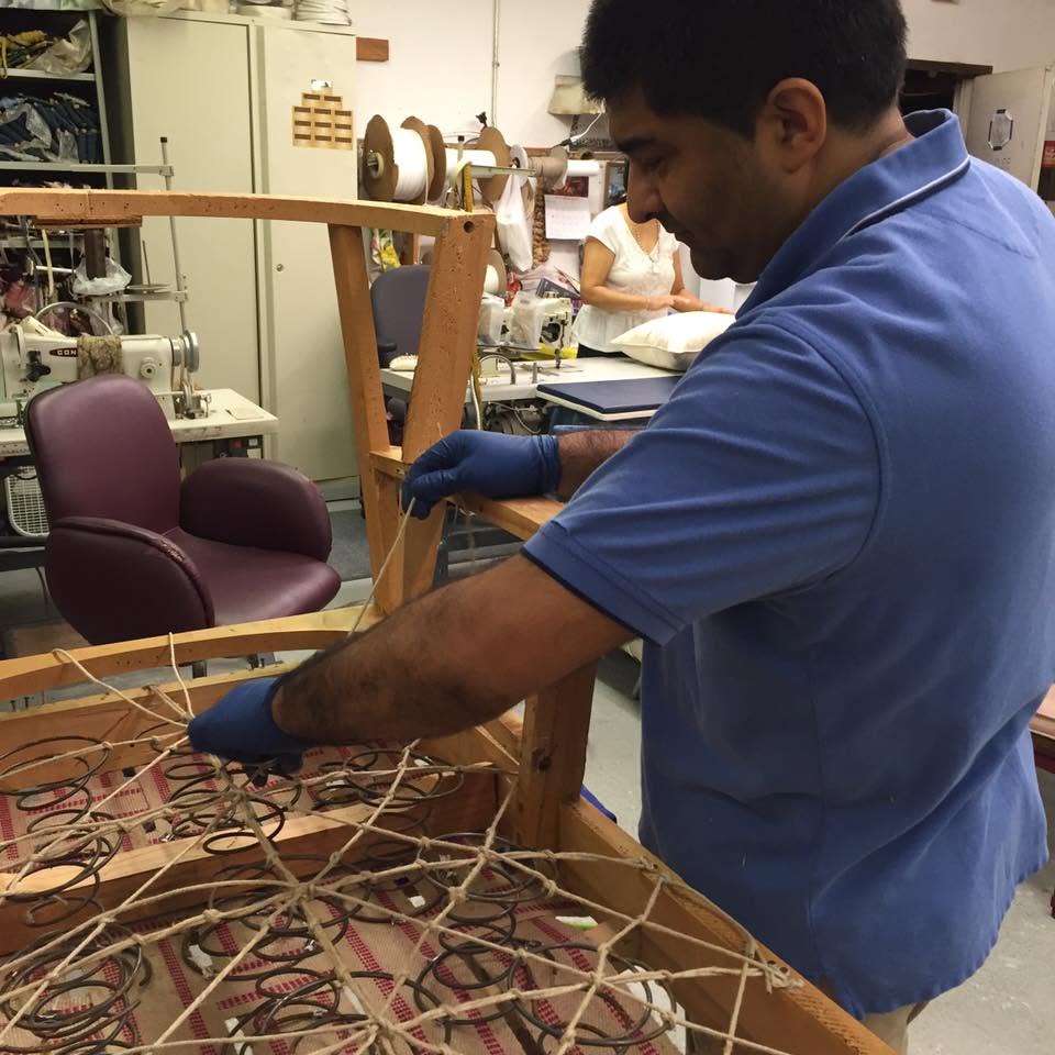 Family-owned upholstery team working together in the shop